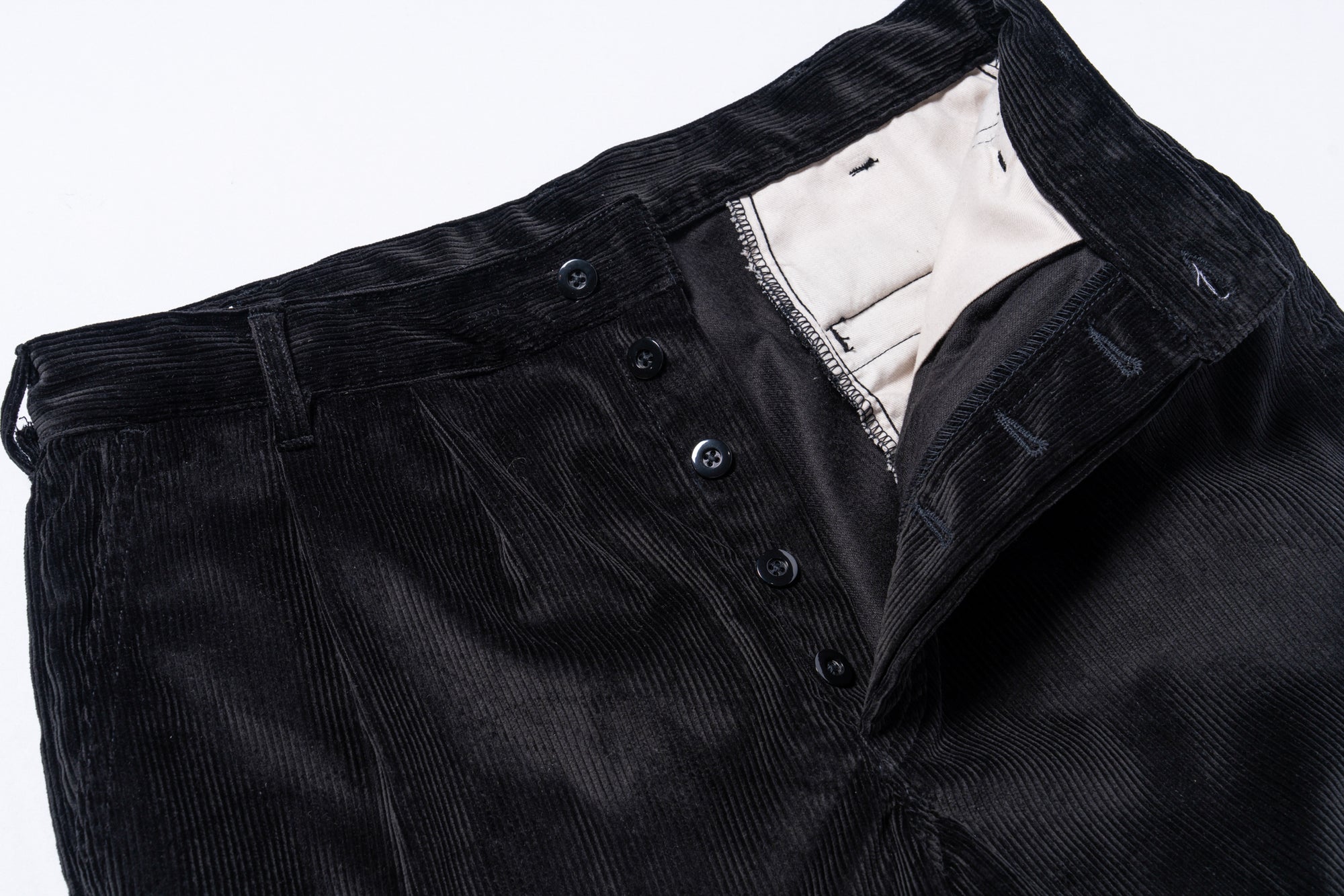 DOUBLE-PLEAT CORDUROY TROUSERS